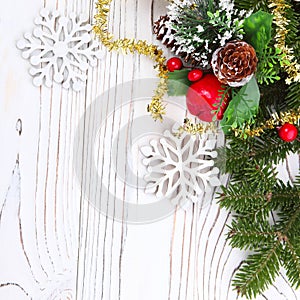 Christmas candle and decorations on white wooden table with copy