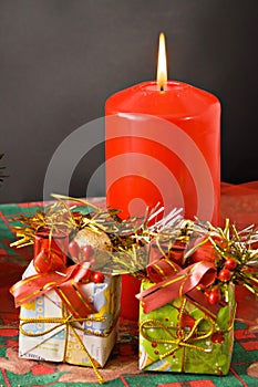 Christmas candle and gifts