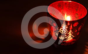 Christmas candle holders glowing red.