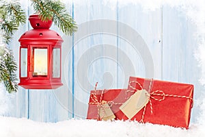 Christmas candle lantern, gift boxes and fir tree