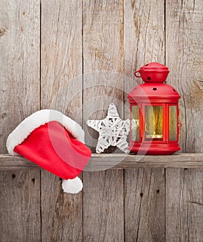 Christmas candle lantern, santa hat and decor
