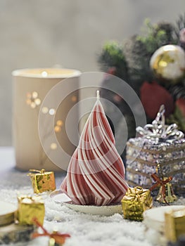 Christmas Candle. New Year's composition with candle in the shape of a Christmas tree. Candles made of natural wax.