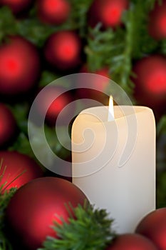 Christmas Candle with Red Baubles over Black