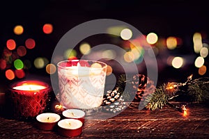 Christmas candle and rustic decoration on wood table