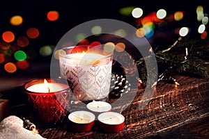 Christmas candle and rustic decoration on wood table