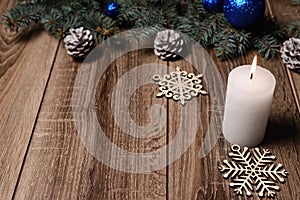 Christmas candle on a wooden background