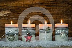 Christmas candles decorated with ornaments for Advent Season