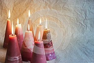 Christmas candles. Decoration on crumpled paper background