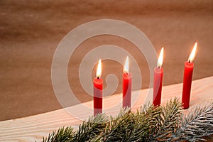 Christmas candles and fir tree branch