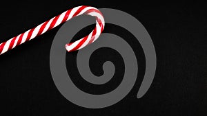 Christmas candy cane on black background. isolate. Flat lay, top view, copy space