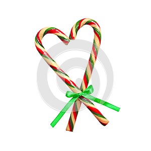 Christmas candy cane heart isolated on white. New Year Christmas decoration candy canes ribbon with bow