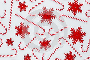 Christmas candy cane lied on blue background. Flat lay and top view