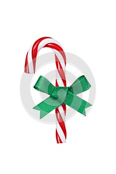 Christmas candy cane with light green bow isolated on white background