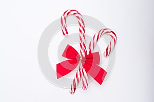 Christmas Candy Cane with Red Bow Isolated on White Background