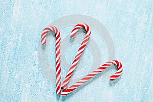 Christmas candy canes on blue background