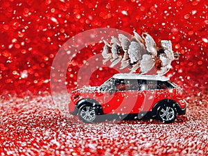 Christmas car with pine cones on red background. Christmas and New Year concept