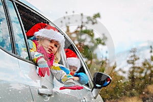 Christmas car travel- happy kids travel in winter