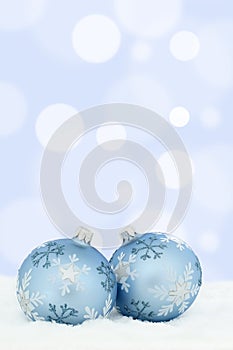 Christmas card balls baubles blue background snow decoration