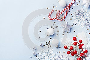 Christmas card or banner. Christmas silver decorations on blue background