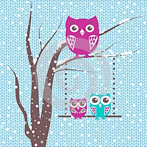 Christmas card a branch with family of owls in winter