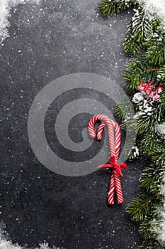 Christmas card with candy canes and fir tree