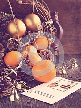 Christmas Card with Christmas decoration, oranges and pine cones