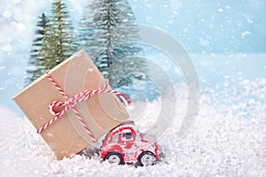 Christmas card for Christmas and New Year. Holiday composition with pine trees, toy red car and gift box