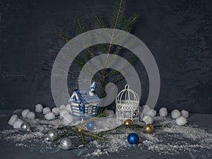 Christmas card with decorative Christmas toys with strong snow on the Black wooden background