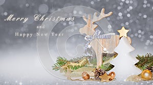 Christmas card with fir tree shaped candle, reindeer, golden decoration and Merry Christmas text