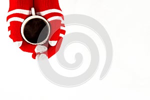 Christmas card, gloves on hands holding cup of cofee isolated on