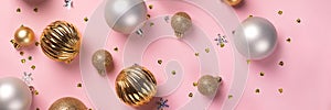 Christmas card with golden and silver balls on pink background banner