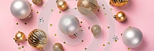 Christmas card with golden and silver balls on pink background banner