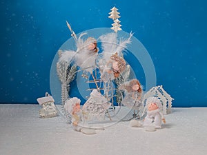 Christmas card with angels on a blue background photo
