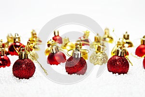 Christmas card, illustration with golden baubles, balls, decorations, ornaments on a silver white background with blurry, blurred