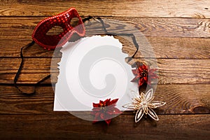 Christmas card and New Year accessories on brown wooden table. Top view. Copy space and place for text
