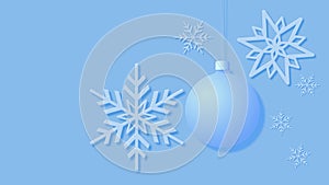 Christmas card showing snowflakes and a Christmas tree bauble