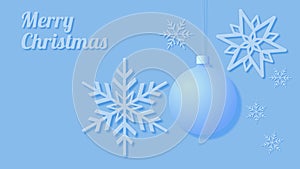 Christmas card showing snowflakes and a Christmas tree bauble