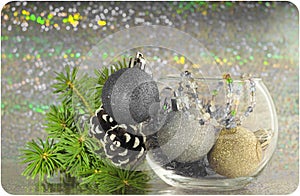 Christmas card: spruce branches, cones and Christmas balls in a vase