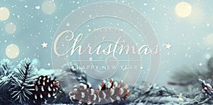 Christmas card with tree branches and pine cones. Merry Xmas background with lights on blue snowy surface. Happy New Year.