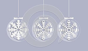 Christmas card with white snowflakes in glass balls.