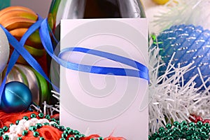 Christmas card with wine bottle pearls and empty paper note