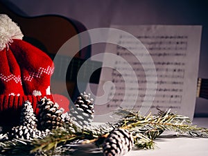 Christmas carols with pine cones and needles winter display