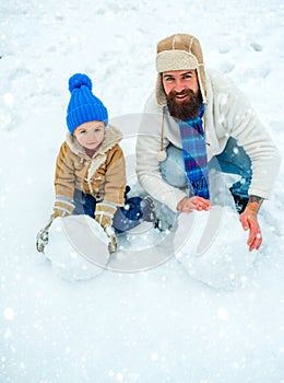 Christmas Celebration holiday. Fathers day. Christmas holidays. Father and son play in winter clothes. Winter portrait