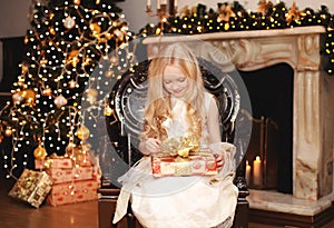 Christmas, celebration, people concept - happy child with gift