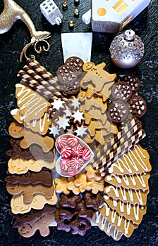 Christmas charcuterie board with gingerbread, chocolate and shortbread cookies.