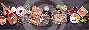 Christmas charcuterie table scene against a dark wood banner background