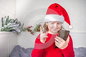 Christmas child girl photo with smartphone