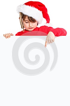 Christmas child kid girl Santa Claus pointing empty banner portrait format copyspace isolated