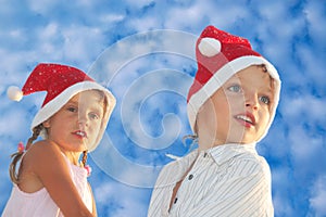 Christmas children against the blue sky