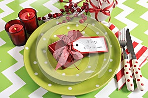 Christmas children family party table place settings in lime green, red and white